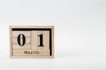 Wooden calendar March 01 on a white background