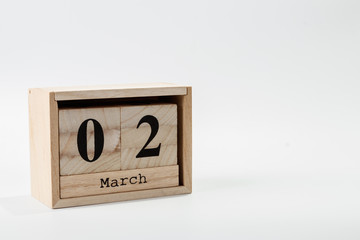 Wooden calendar March 02 on a white background