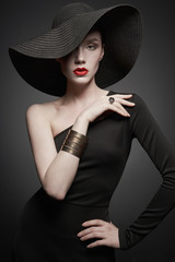 portrait of young lady with black hat and evening dress