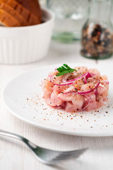 dish food of raw fish with whitefish on a light surface. national dish of the Northern peoples