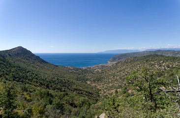 View to the sea from the slope of coastal mountains.
