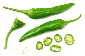 green hot chili peppers with slices isolated on white background top view