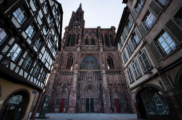 View of Strasbourg Notre Dame cathedral from the street between houses, France