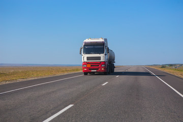 Fototapeta na wymiar Gas-Tank Truck Goes on Highway