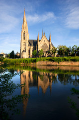 Portrait frame view of St. Paul's church from the front side of the river by reflections, France