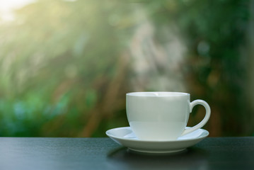 Coffee in a white cup on the table