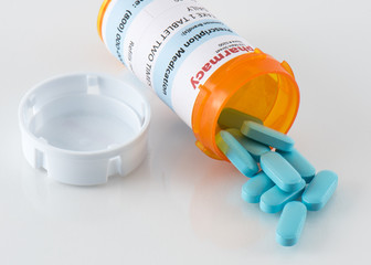 Prescription Pill Bottle with Blue Pills