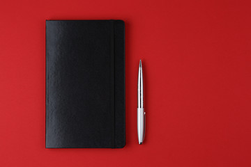 leather notebook on red background