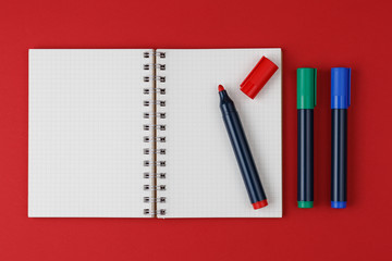 open notebook with colored markers