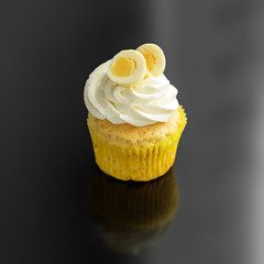 Sweet yummy cupcake with vanilla cream. The concept of food, desserts, holiday.