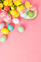 Fototapeta na wymiar Easter eggs tulip flowers pink background decoration
