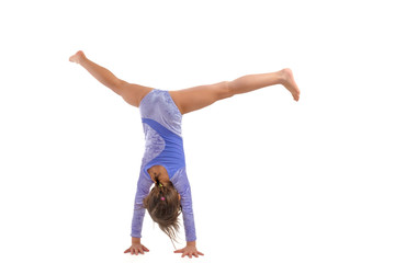 Little gymnast on a white background. Sporting exercise, stretch, flexibility, aerobics