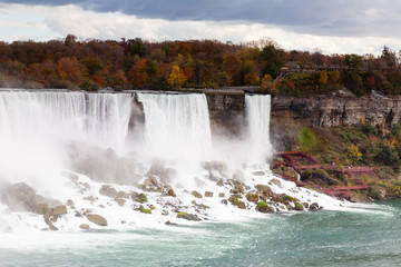 Niagara Falls.  A close up view of the American Falls, a part of the Niagara Falls.  The falls straddle the border between America and Canada.