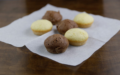 Several cupcakes are on a paper napkin
