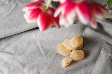 Marmalade and tulips on the gray background