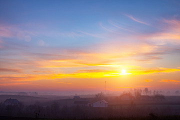 Fototapeta premium sunset in the field. beautiful autumn foggy landscape in Ukraine