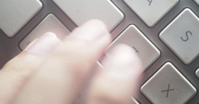 Close-up 4K shot of finger hitting the undo button (control + z) after a mistake.