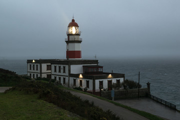 Cape Silleiro lighthouse on a stormy day. The lighthouse is located in Baiona province of...