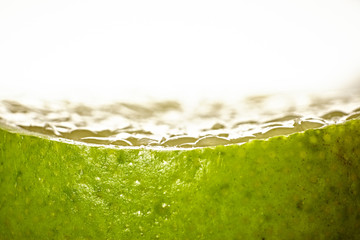 the green lime in front on a white background 