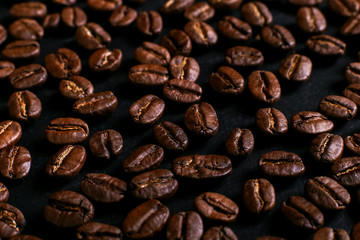 Fragrant coffee beans on rustic tabletop background. Banner copy space.