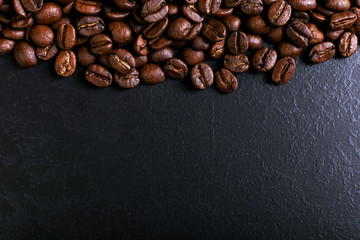 Fragrant coffee beans on rustic tabletop background. Banner copy space.