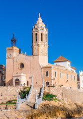 Fototapeta na wymiar Sitges church with a blue sky Sant Bartomeu & Santa Tecla in Barcelona, Spain