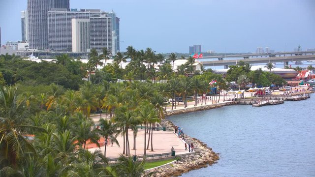 Generic Miami Waterfront Recreation Scene at Bayfront Park with Tourists Walking Along Tropical Palm Trees in the Popular Downtown South Florida Area