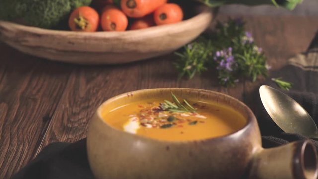 Healthy Pumpkin soup with cream and organic pumpkin seeds.