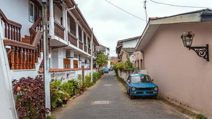 Old European Street With Blue Car