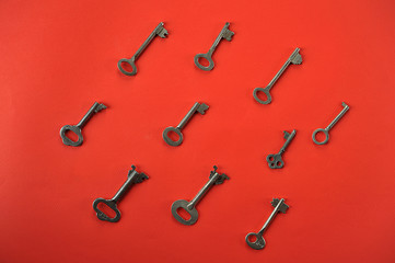 vintage key on red background with space for text