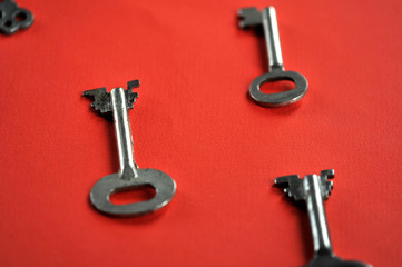 vintage key on red background with space for text