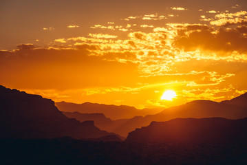 Sunset above mountains in Wadi Rum valley in Jordan