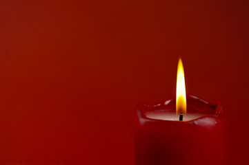 candle flame on red background