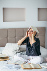 Exhausted young woman learning