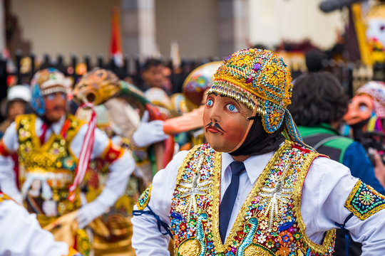 People wearing costumes at a Peruvian festival