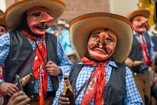 People wearing costumes at a Peruvian festival