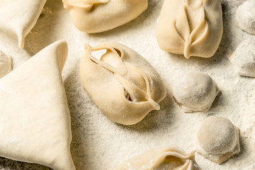 Traditional oriental, Uzbek cuisine, chuchvara, manti and samsa, a set of dishes made in one set