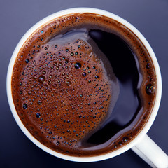 coffee in white Cup on dark background