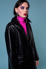 Fototapeta premium Beautiful fashionable short hair woman in leather clothing