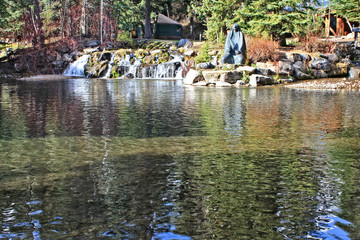 Pond and native american statue by Skip Weeks