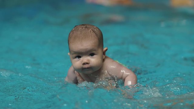 Funy baby in the pool