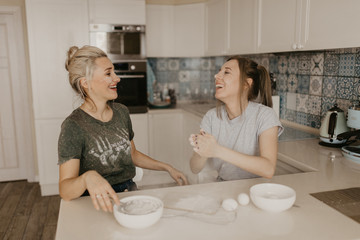  beautiful girls have breakfast in the kitchen