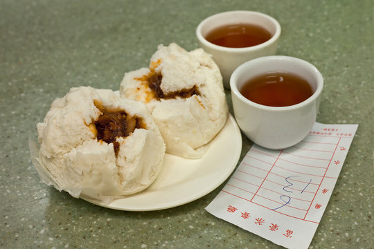 Traditional Bao, BBQ pork filled buns, served with tea in Kowloon, Hong Kong, China