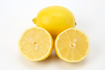 Cut citrus fruit of  lemon on white background