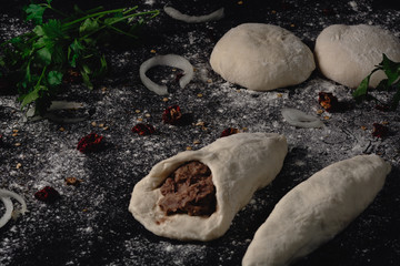 Lobiani - traditional dish of Georgian food. Baked closed pie or bread with white beans or red beans filling. Cooking process pie with beans, harincot, parsley, red pepper, flour, beans