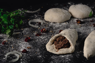 Lobiani - traditional dish of Georgian food. Baked closed pie or bread with white beans or red beans filling. Cooking process pie with beans, harincot, parsley, red pepper, flour, beans