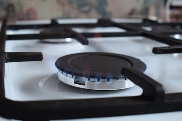 Gas stove, blue fire. The use of domestic gas for domestic purposes