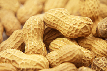 Peanut in a shell texture. Food background of peanuts