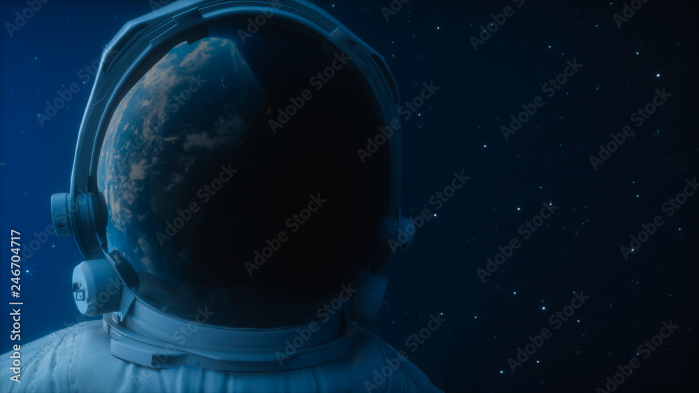 Wall mural a lone astronaut looks at the planet earth in orbit in outer space, the planet earth reflects in a s