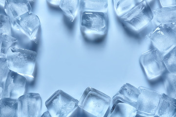 Frame made of ice cubes on color background, top view. Space for text
